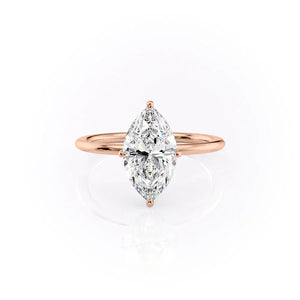 The Crown Kamellie Set With A 1.5 Carat Marquise Moissanite