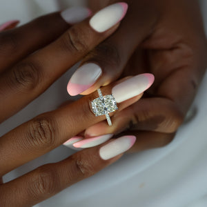 The Pave Crown Kamellie Set With A 2 Carat Elongated Cushion Moissanite