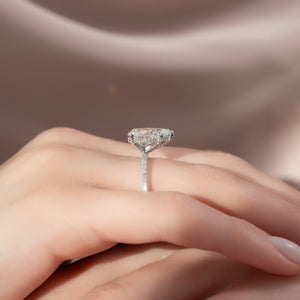 The Pave Crown Kamellie Set With A Pear Moissanite