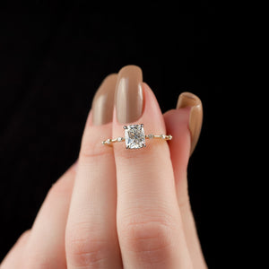 The Hidden Halo Penelope Set With A 1.5 Carat Elongated Cushion Moissanite