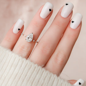 The Hidden Halo Penelope Set With A 4.5 Carat Pear Moissanite