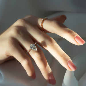 The Hidden Halo Penelope Set With A 4.5 Carat Pear Moissanite