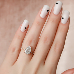 The Hidden Halo Penelope Set With A 4.5 Carat Pear Moissanite