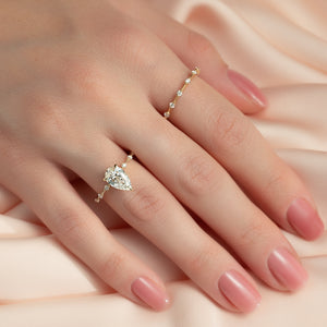 The Penelope Set With A 1.5 Carat Pear Moissanite