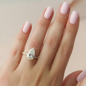 The Khloe Set With A 1.5 Carat Pear Moissanite