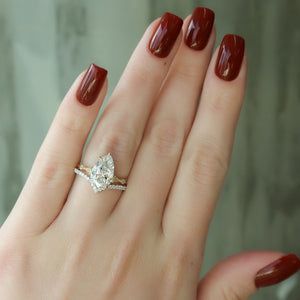 The Amber Set With A 1.5 Carat Pear Moissanite