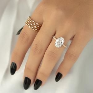 The Low Profile Kamellie Set With A 1.5 Carat Oval Moissanite
