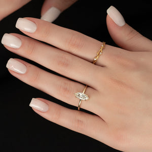 The Low Profile Kamellie Set With A 1.5 Carat Marquise Lab Diamond