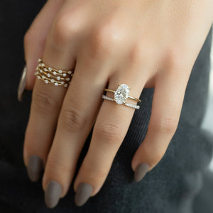 The Low Profile Kamellie Set With A Oval Moissanite