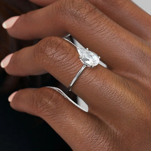The Petal Kamellie Set With A 2.5 Carat Pear Moissanite