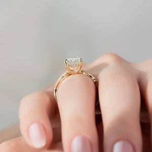 The Pave Twig Set With A Emerald Moissanite