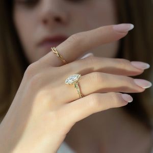 The Pave Twig Set With A 1.5 Carat Marquise Moissanite