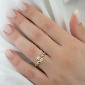 The Pave Twig Set With A 2.5 Carat Oval Lab Diamond