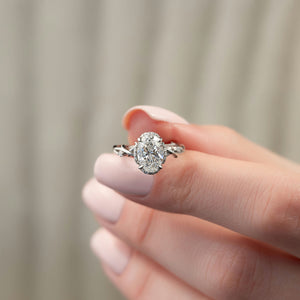 The Halo Twig Set With A 1.5 Carat Oval Lab Diamond