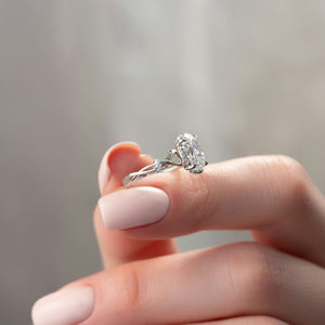 The Halo Twig Set With A 1.5 Carat Oval Lab Diamond