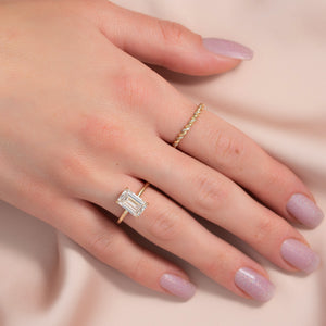 The Pave Sarah Set With A 1.5 Carat Emerald Moissanite