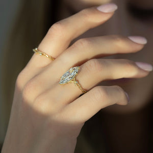The Textured Twig Set With A Marquise Moissanite