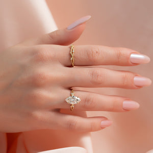 The Textured Twig Set With A Marquise Moissanite