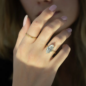 The Textured Twig Set With A Marquise Moissanite