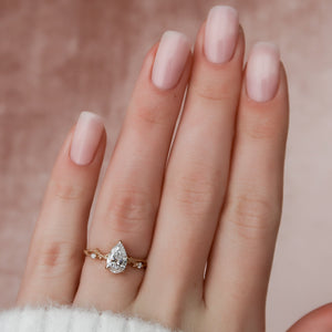 The Textured Twig Set With A 1.5 Carat Pear Lab Diamond