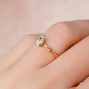 The Textured Twig Set With A 1.5 Carat Pear Lab Diamond