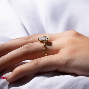 The Textured Twig Set With A Pear Moissanite