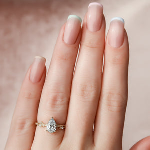 The Textured Twig Set With A Pear Moissanite
