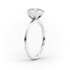 The Razor Bezel Kamellie Set With A 3 Carat Radiant Moissanite