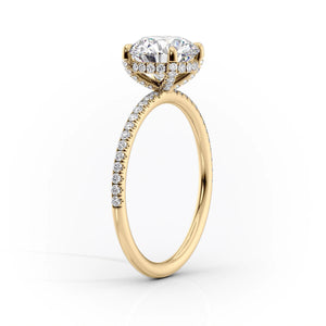 The Pave Crown Kamellie Set With A 4.5 Carat Pear Moissanite